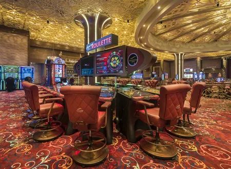 Electronic roulette terminals under a gold ceiling
